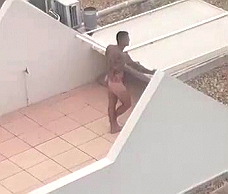 Naked Dude On A Balcony