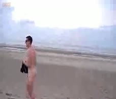 Dude Walks Naked On The Beach