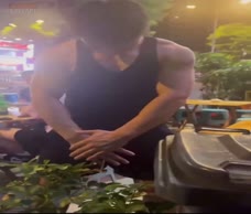 Asian Lad Waters The Plants
