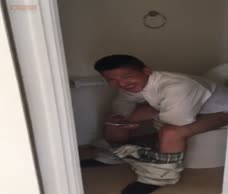 Asian Lad On The Toilet