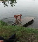 Naked Man Swims In A Lake