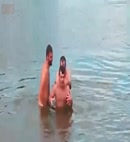 Naked Men In A Lake