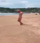 Naked Blond Man At The Beach