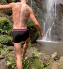 Naked Man In A Waterfall