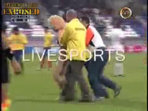 A Naked Man Runs During A Football Match