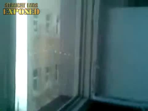Lad Pissing On A Window
