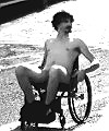 Naked Man Riding In A Wheelchair 