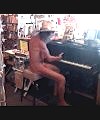 Naked Bookseller Plays Piano