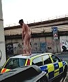 Naked Man On A Police Car