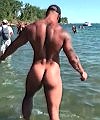 Naked Muscle Man At The Beach