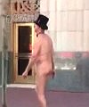 A Naked Man Is Skating On The Street