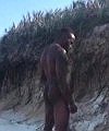 Black Man Pissing At The Beach